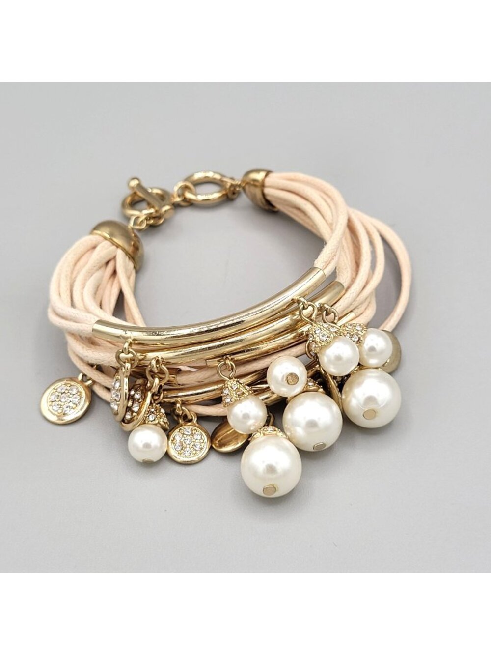 Bella Jack Multi Strand Bracelet Beige Cords Hanging Baubles Gold Tone Metal